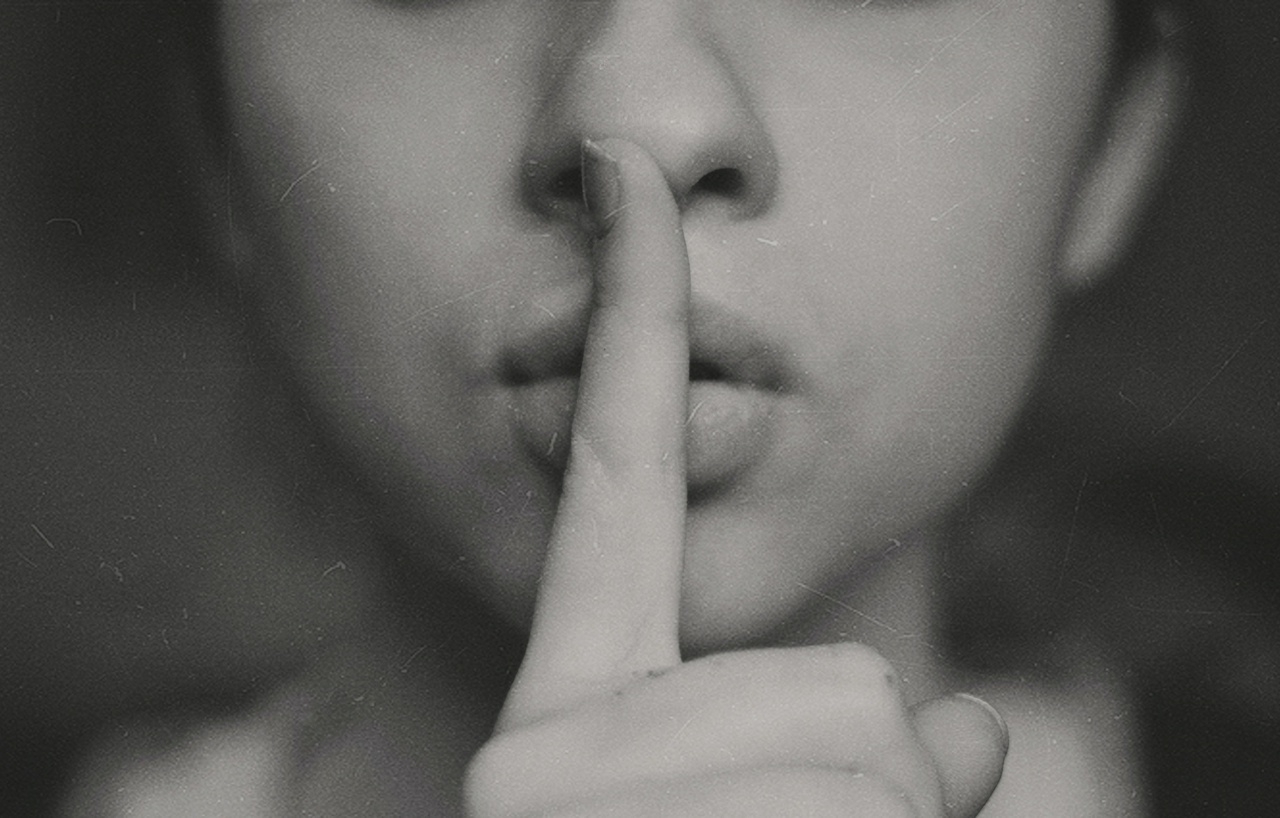 Photo of a woman with her finger over her mouth by Kristina Flour on Unsplash