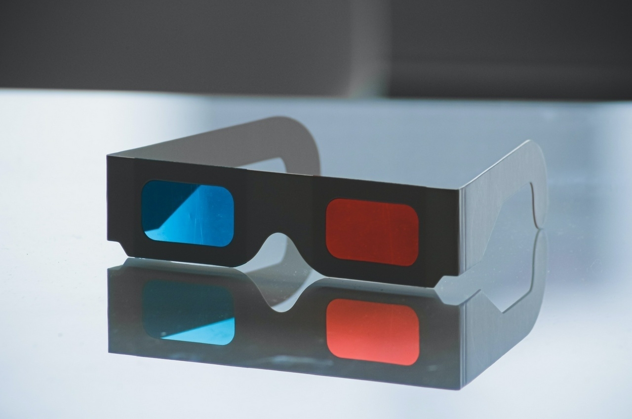 3d glasses on reflective table